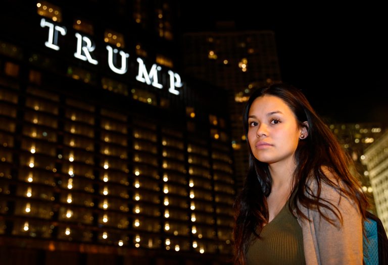 In this Nov. 17, 2016 photo, Nancy Villa stands on a street in Chicago. Villa was brought to the U.S. illegally from Mexico while a child. She has a work permit through a 2012 federal program started under Obama's administration and works at a Chicago child care center and attends college. She and three siblings have DACA, while two siblings are U.S. citizens. (AP Photo/Nam Y. Huh)