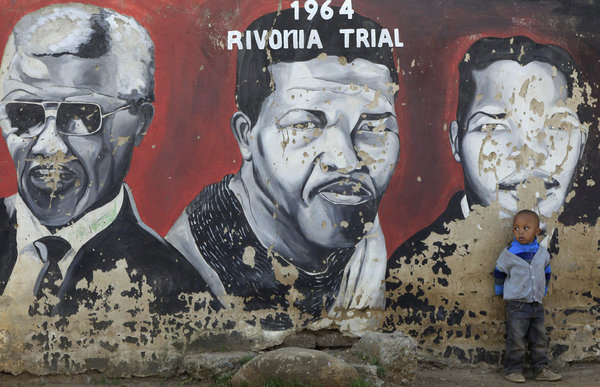 A mural of Nelson Mandela, the former South African president, on a wall in Johannesburg. AP Photo.