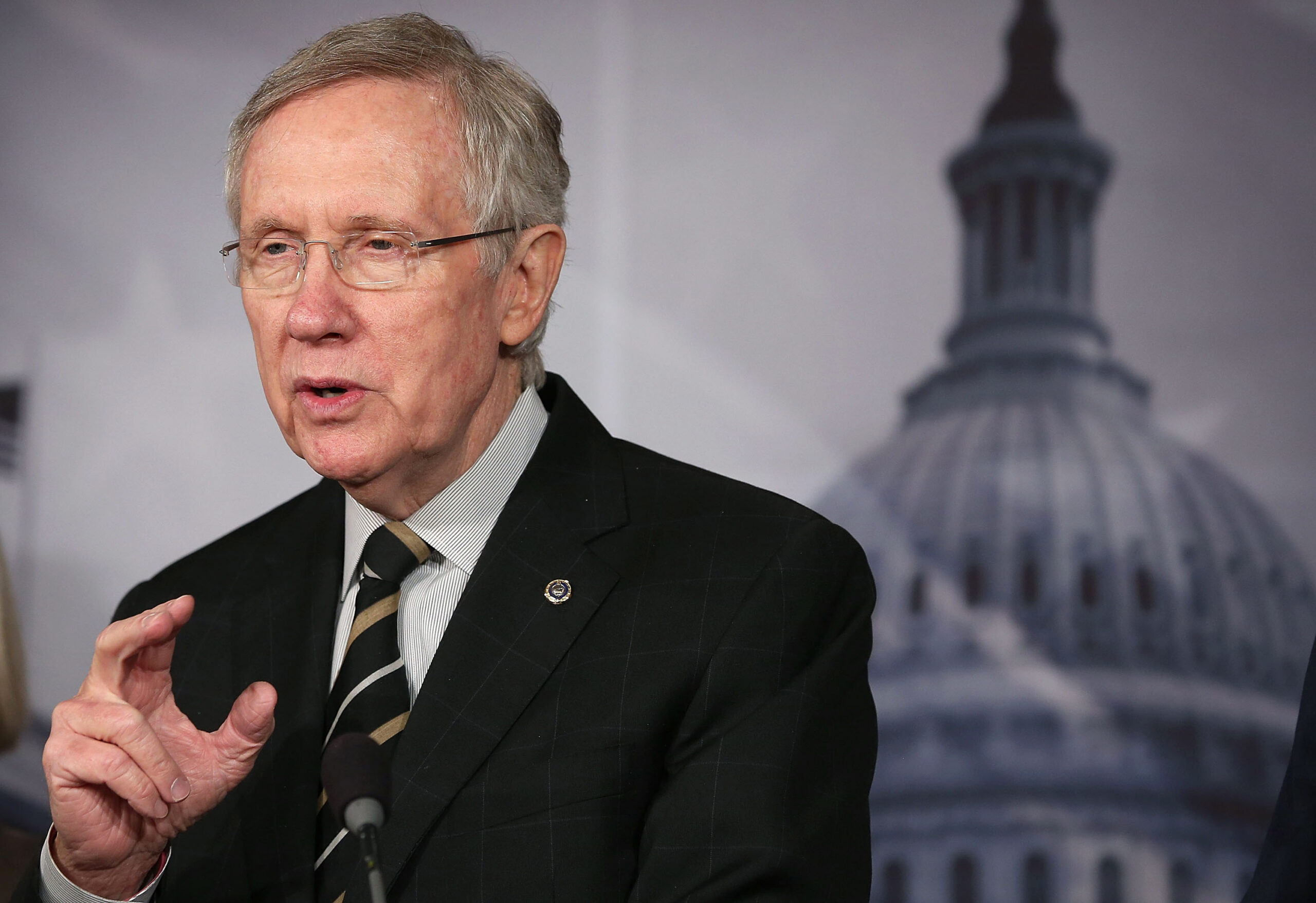 Reid insists that any sequester solution include tax hike