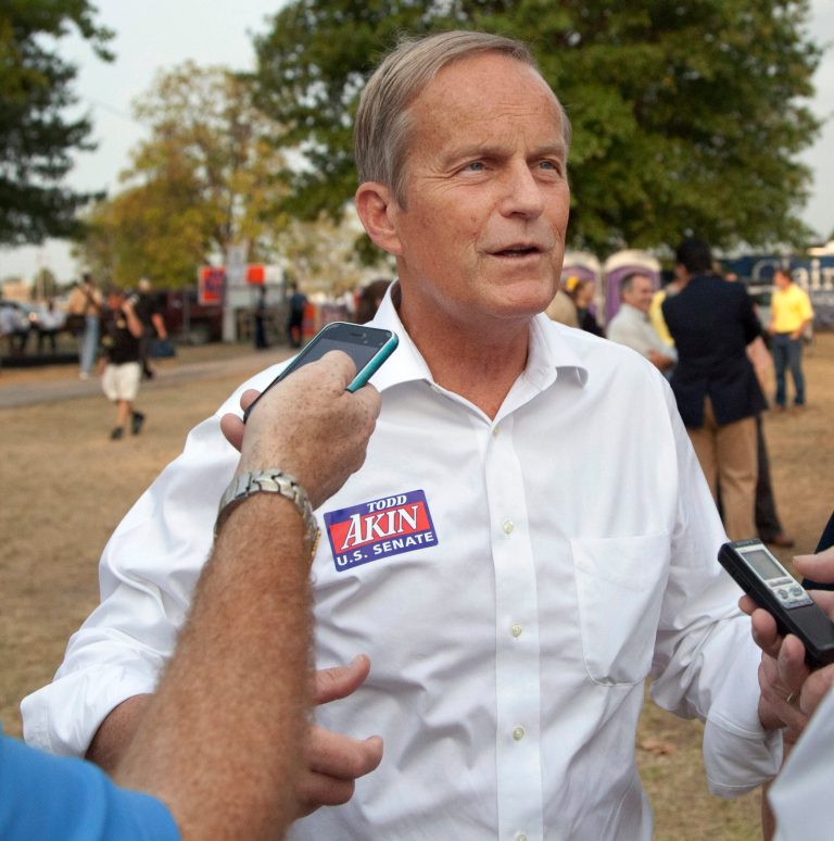 In this Thursday, Aug. 16, 2012 photograph, Rep. Todd Akin, R-Mo., talks with reporters while attending the Governor's Ham Breakfast at the Missouri State Fair in Sedalia, Mo. Akin was keeping a low profile, Monday, Aug. 20, 2012, a day after a TV interview in which he said that women's bodies can prevent pregnancies in 