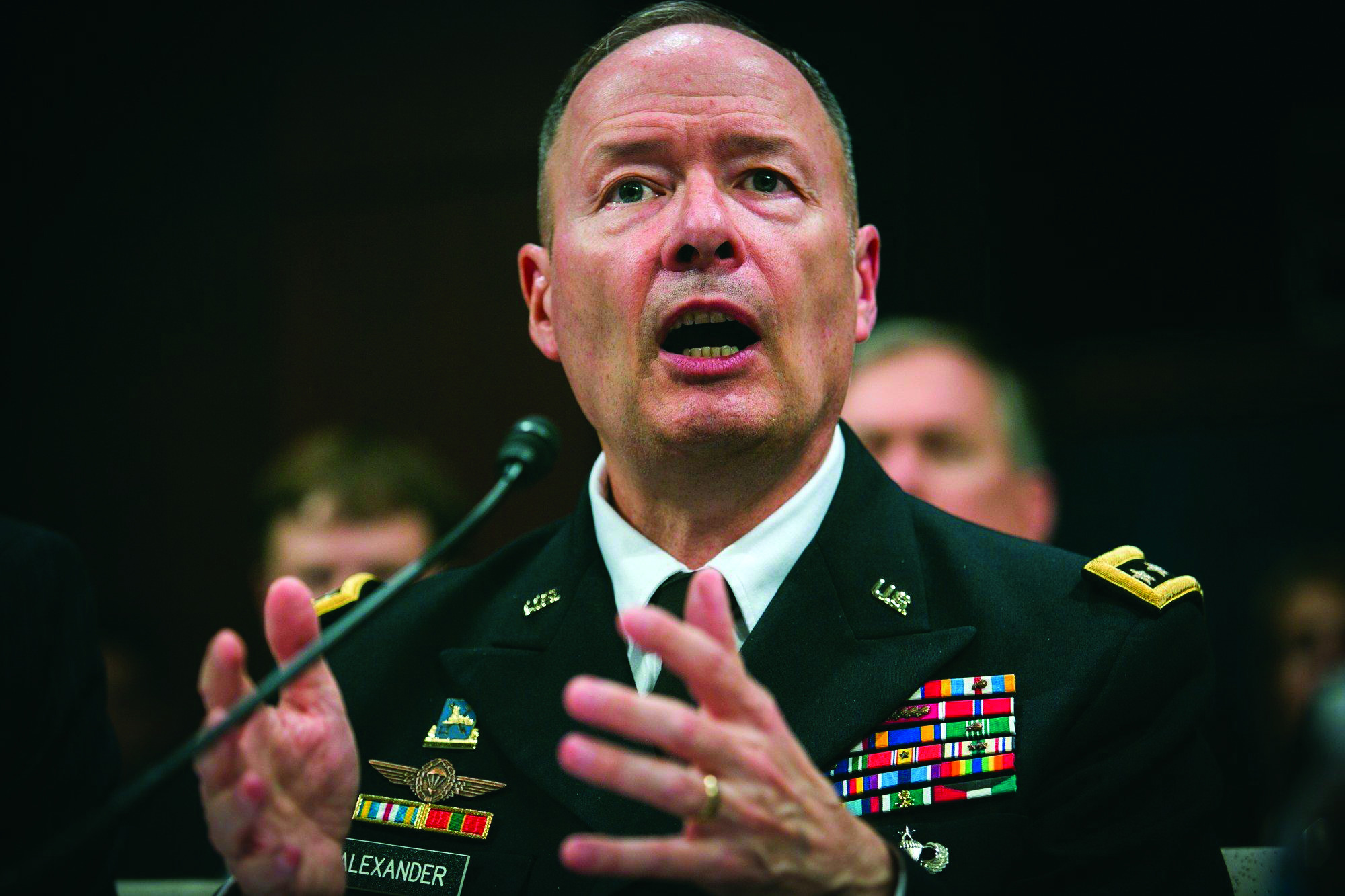On the slide: NSA Director Gen. Keith Alexander defends surveillance programs