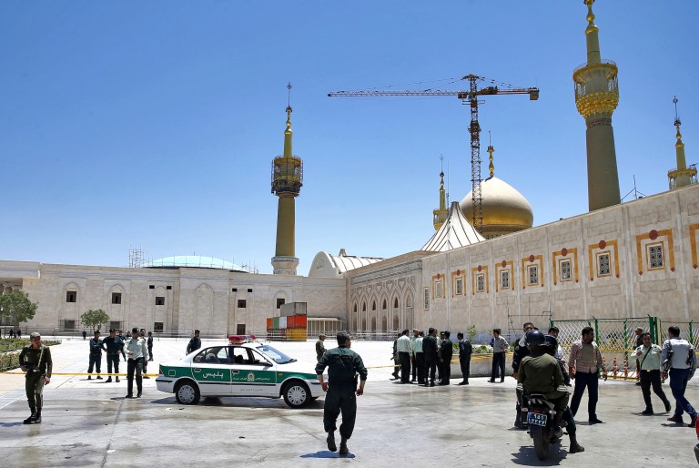 Gunmen attacked the Iranian Parliament and the shrine of Ayatollah Khomeini in Tehran, Iran, killing at least 12 people and wounding many others. (AP Photo/Ebrahim Noroozi)