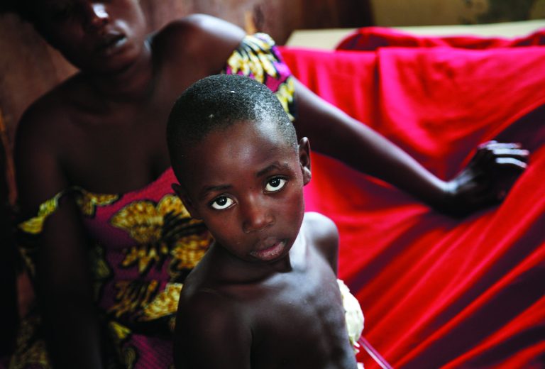 Junior Mutsima, 11, who was wounded by a bullet to the thorax Nov. 19 2012, sits on his bed at the Heal Africa hospital in Goma Monday Nov. 26, 2012. Regional leaders meeting in Uganda called for an end to the advance by M23 rebels toward Congo's capital, and also urged the Congolese government to sit down with rebel leaders as residents fled some towns for fear of more fighting between the rebels and army.(AP Photo/Jerome Delay )
