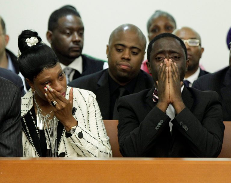   Constance Malcolm and Frank Graham, parents of 18-year-old Ramarley Graham, weep during the arraignment of New York City Police Dept. officer Richard Haste, in Bronx Supreme Court, in New York, Wednesday, June 13, 2012. Police pursued Graham into his Bronx home during a drug investigation last February. He was shot once at close range. (AP Photo/Richard Drew, Pool)  