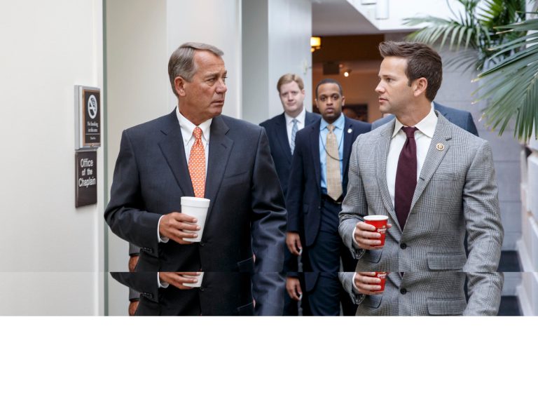 House Speaker John Boehner of Ohio, , left, walks with Rep. Aaron Schock, R-Ill., on Capitol Hill in Washington, Friday, as House Republicans head to a closed-door meeting on thwarting President Barack Obama's executive actions on immigration by blocking the funding for the Department of Homeland Security. (AP Photo/J. Scott Applewhite)
