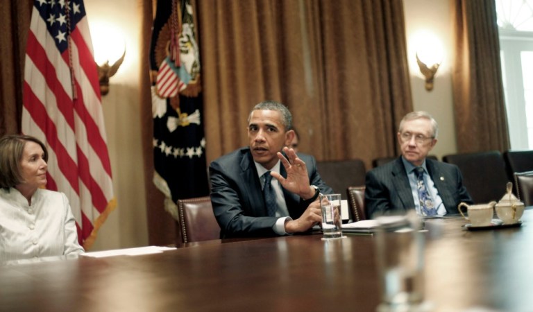 House Minority Leader Nancy Pelosi, of California, and Senate Minority Leader Harry Reid, of Nevada, huddled with President Obama on the second day Congress remained closed due to record snowfall in Washington, D.C., over the weekend. (AP Photo)