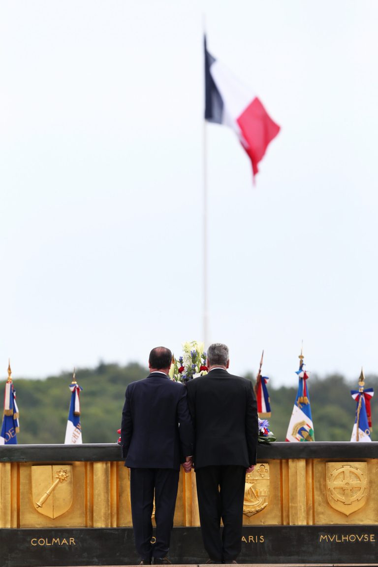 France's President Francois Hollande, left, and German President Joachim Gauck pay respect during a ceremony to mark the 100th anniversary of the outbreak of World War I, at the National Monument of Hartmannswillerkop, in Wattwiller, eastern France, Sunday, Aug. 3, 2014. On this day 100-years ago, in 1914, Germany declared war on France, at the beginning of the first global war, which centered on Europe and resulted in over nine million combatants being killed. (AP Photo/Thibault Camus)