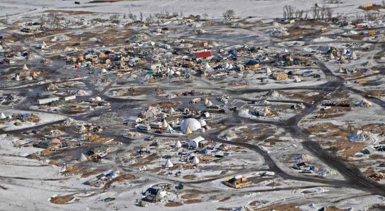 A multi-million dollar cleanup operation is needed to keep mounds of trash from being washed into the Missouri River. (Tom Stromme, Bismarck Tribune via AP)