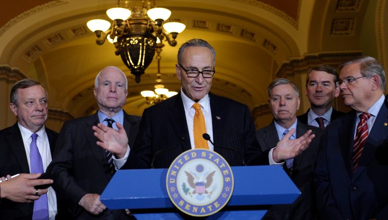 Sen. Chuck Schumer, D-N.Y., center, speaks following a vote in the Senate on immigration reform on Capitol Hill in Washington on Thursday. Schumer is joined by, from left, Sen. Dick Durbin, D-Ill., Sen. John McCain, R-Ariz., D-N.Y., Sen. Lindsey Graham, Sen. Michael Bennet, D-Colo., and Sen. Robert Menendez, D-N.J.  (AP Photo/Susan Walsh)