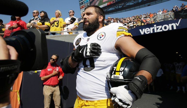 Pittsburgh Steelers offensive tackle and former Army Ranger Alejandro Villanueva stands outside the tunnel alone during the national anthem before an NFL football game against the Chicago Bears. (AP Photo/Nam Y. Huh)