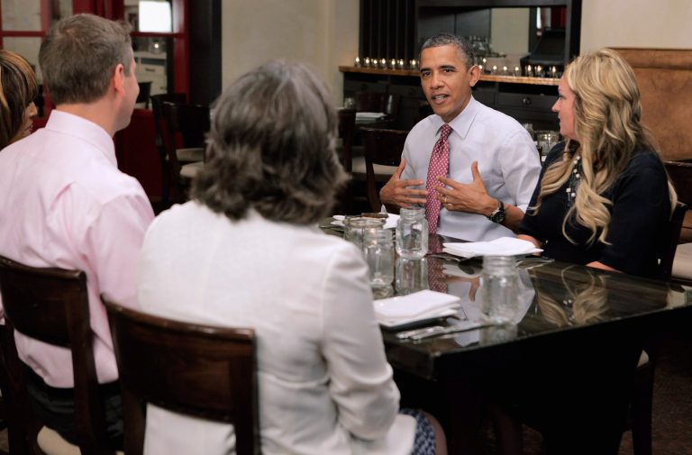 President Obama sits down to lunch with supporters who won a campaign contest at Lincoln restaurant June 15, 2012 in Washington. For the next context, dinner with the first couple, the president is even offering to help butter-up babysitters.. (Photo by Chip Somodevilla/Getty Images)