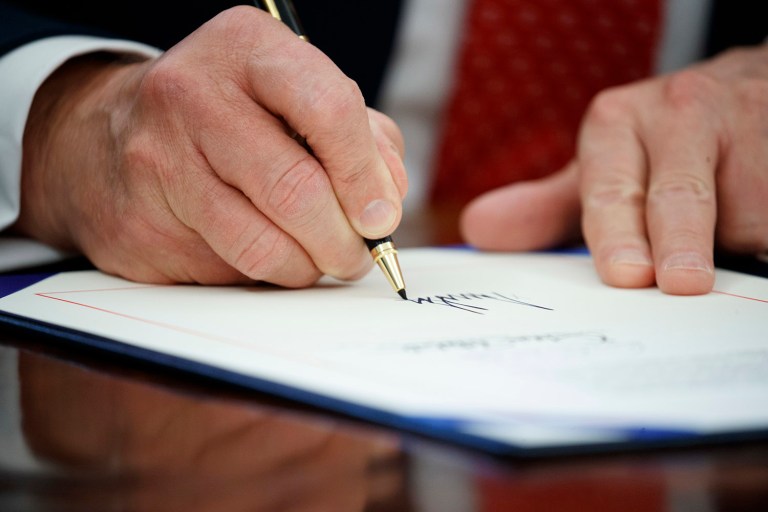 The following is the full text of the executive order signed by President Trump revising his travel ban in the name of protecting the United States from terrorism. (AP Photo/Evan Vucci)