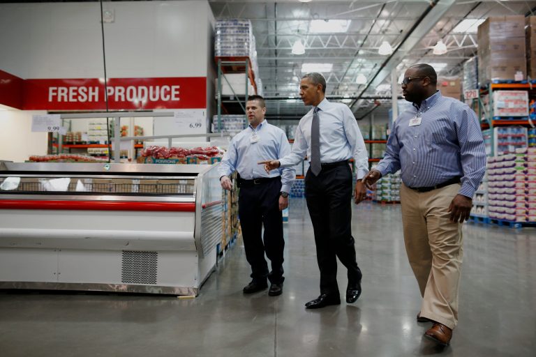 President Barack Obama walks with Ricky Banner, assistant general manager, right, and Emile (Ray) Quevedo, floor employee, at a Costco store in Lanham, Md., Wednesday, Jan. 29, 2014, before he spoke about raising the minimum wage. The president is promoting his newly unveiled plans to boost wages for some workers and help Americans save for retirement _ no action from Congress necessary. (AP Photo/Charles Dharapak)