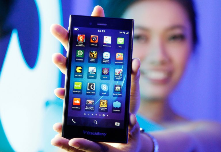 A Blackberry Z3 smartphone is shown by a model during its launch in Jakarta, Indonesia, Monday, May 13, 2014. The Z3 is priced at (US$200) in the country. (AP Photo/Achmad Ibrahim)