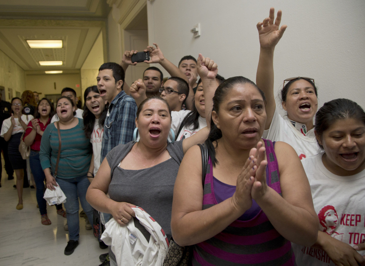 People shout out against the Strengthen and Fortify Enforcement Act in the hall outside the House Judiciary Committee.