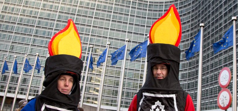 Protestors from an anti-fracking group wait for the start of a demonstration outside EU headquarters in Brussels on Wednesday, Jan. 22, 2014. The European Commission on Wednesday proposed a framework for climate and energy policies beyond 2020 and up to 2030. (AP Photo/Virginia Mayo)