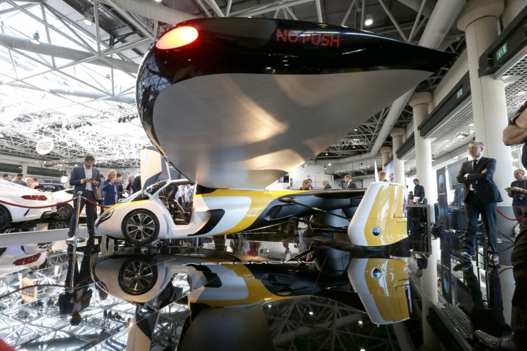 AeroMobil display their latest prototype of a flying car, in Monaco, on April 20. The light frame plane whose wings can fold back, like an insect is boosted by a rear propeller. The company says it is planning to accept first preorders for the vehicle as soon as later this year. (AP Photo/Claude Paris)