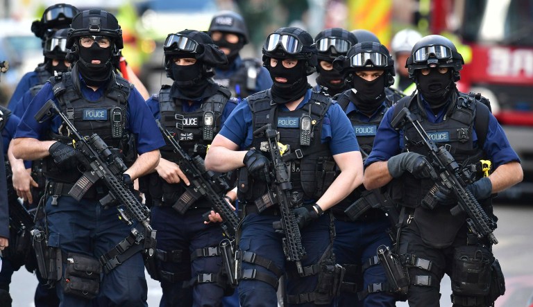 Armed police on St. Thomas Street, London, Sunday June 4, 2017, near the scene of Saturday night's terrorist incident on London Bridge and at Borough Market. (Dominic Lipinski/PA via AP)