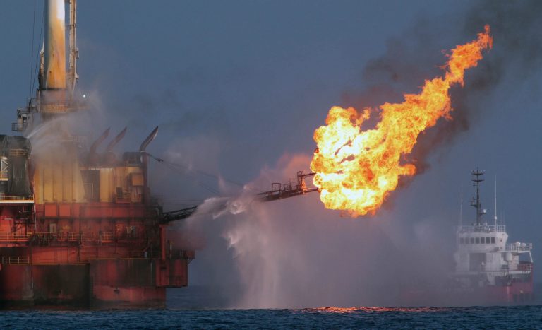 Vessels operate in the area of the Deepwater Horizon disaster on the Gulf of Mexico, Tuesday, July 13, 2010. (AP Photo/Dave Martin)