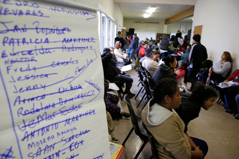 A waiting room is filled with applicants waiting to be called during a health care enrollment event at the Bay Area Rescue Mission in Richmond, Calif. , on March 31. (AP Photo/Eric Risberg, File)