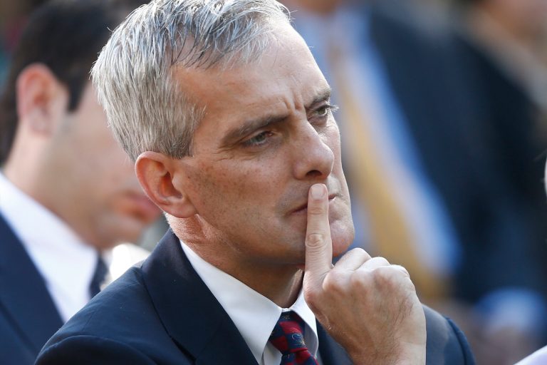 FILE - This Oct. 21, 2013 file photo shows White House Chief of Staff Denis McDonough listening to President Barack Obama speak in the Rose Garden of the White House in Washington. The White House is escalating an election-year dispute with Congress over military spending as lawmakers bucked the Pentagon and spared favorite ships and aircraft despite diminishing budgets. One day after a veto threat,  McDonough met privately with House Democrats on Tuesday and criticized the $601 billion defense authorization bill for parochial changes as the Defense Department deals with smaller budgets. Projected defense spending has been reduced after a decade of wars in Iraq and Afghanistan and amid congressional deficit hawks demand for less federal dollars. (AP Photo/Charles Dharapak, File)