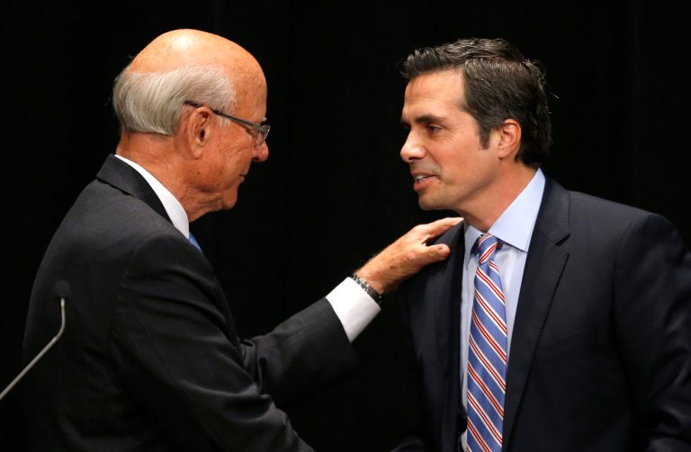 Orman (right) greets his opponent, Sen. Pat Roberts, before their debate on Oct. 8. (AP/Orlin Wagner)