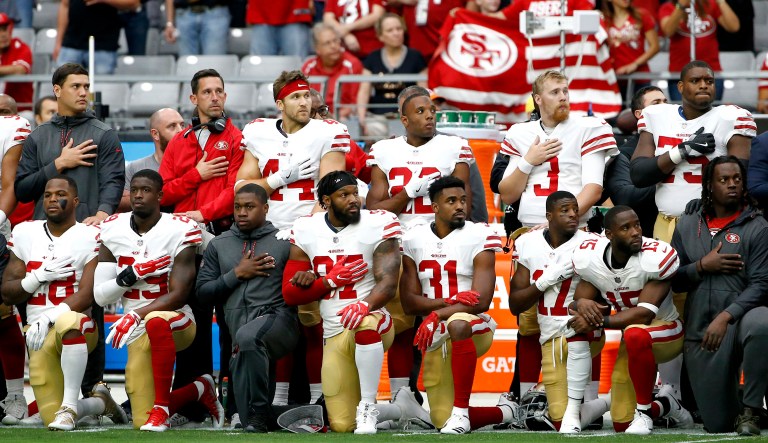 A change in the league's rules could mean that players who kneel or sit during the anthem may be open to punishment. (AP Photo/Ross D. Franklin)
