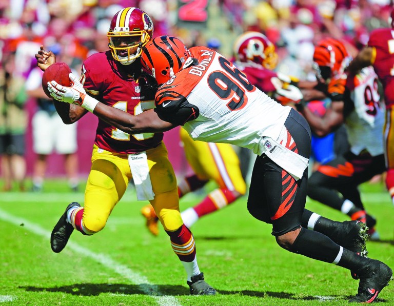 Evan Vucci/AP
In three games this season, Redskins quarterback Robert Griffin III has run the ball 32 times and been sacked nine times.