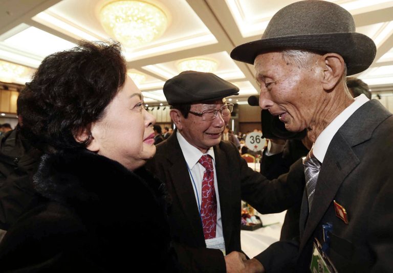 North Korean Nam Gung Ryuck, right, meets with South Korean daughter Nam Gung Bong-ja during the Separated Family Reunion Meeting at Diamond Mountain resort in North Korea, Sunday, Feb. 23, 2014. Elderly North and South Koreans separated for six decades are tearfully reuniting, grateful to embrace children, brothers, sisters and spouses they had thought they might never see again.  (AP Photo/Yonhap, Lee Ji-eun) KOREA OUT