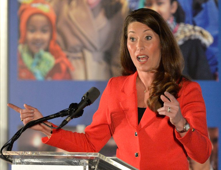 Democratic Senate challenger Alison Lundergan Grimes addresses a group of supporters at a fundraiser at the Galt House Hotel, Tuesday, Feb. 25, 2014, in Louisville, Ky. Republican Sen. Mitch McConnell is going after Grimes on women's issues. (AP Photo/Timothy D. Easley)
