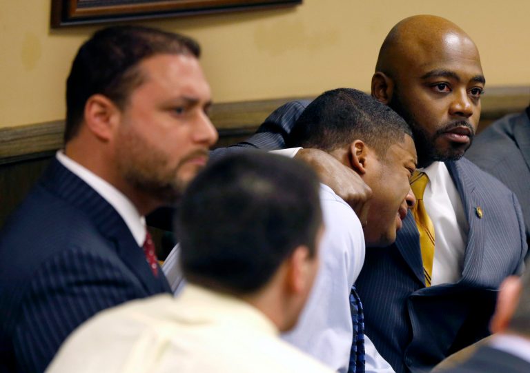 AP10ThingsToSee - Defense attorney Walter Madison, right, holds his client, 16-year-old Ma'Lik Richmond, second from right, while defense attorney Adam Nemann, left, sits with his client Trent Mays, foreground, 17, as Judge Thomas Lipps pronounces them both delinquent on rape and other charges after their trial in juvenile court in Steubenville, Ohio, Sunday, March 17, 2013. Mays and Richmond were accused of raping a 16-year-old West Virginia girl in August 2012. (AP Photo/Keith Srakocic, File)