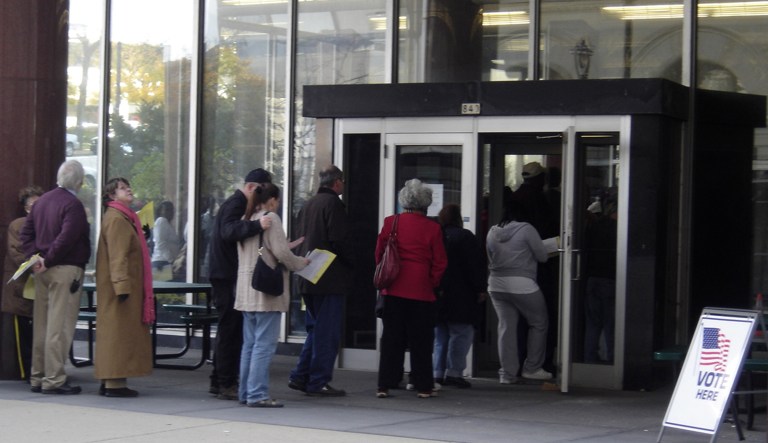 A line for early voting stretches out the door at the Zeidler Municipal Building in downtown Milwaukee. The Supreme Court will hear a Wisconsin case that could decide if the state's redistricting strategy violates the Constitution because it's too partisan. (AP Photo/Dinesh Ramde)