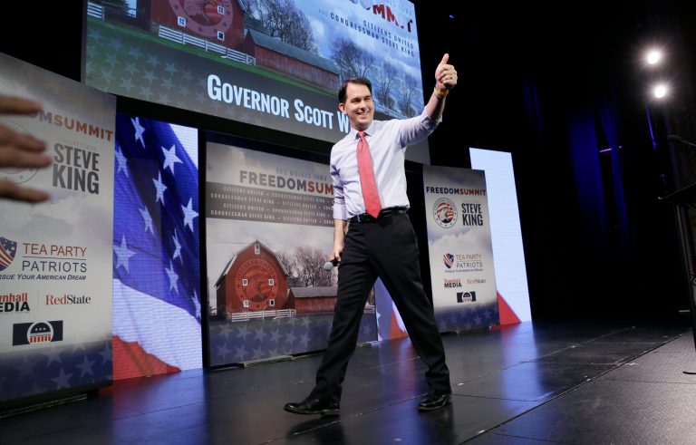 Wisconsin Gov. Scott Walker gestures after speaking at the Freedom Summit, Saturday, Jan. 24, 2015, in Des Moines, Iowa. (AP Photo/Charlie Neibergall)