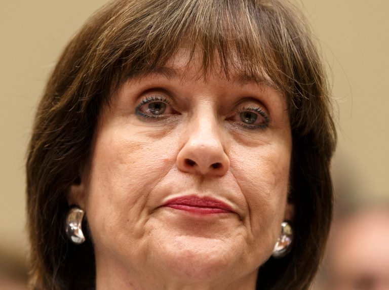 FILE - In this May 22, 2013 file photo, Internal Revenue Service official Lois Lerner refuses to answer questions as the House Oversight Committee holds a hearing to investigate the extra scrutiny the IRS gave Tea Party and other conservative groups that applied for tax-exempt status, on Capitol Hill in Washington. Lerner, a former IRS official at the heart of the agency's tea party controversial called Republicans 
