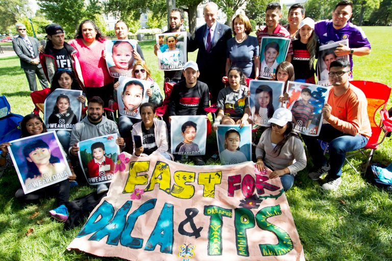 House Minority Leader Nancy Pelosi accompanied by Senate Minority Leader Chuck Schumer pose for a photo with DREAMERS who held a 4-day fast on Capitol Hill on Sept. 7. ( AP Photo/Jose Luis Magana)