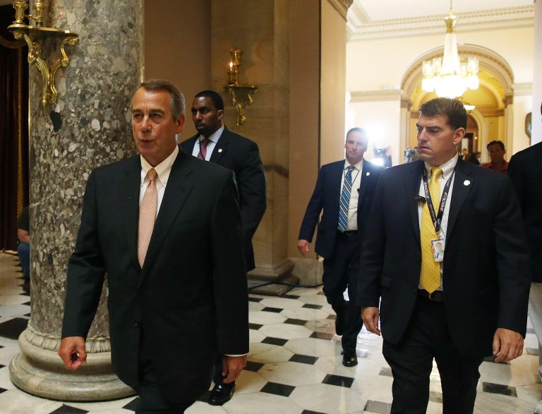 House Speaker John Boehner (R-OH) (L) walks through the halls of Congress before a series of critical votes at the US Capitol June 12, 2015 in Washington, DC. (Photo by Mark Wilson/Getty Images)