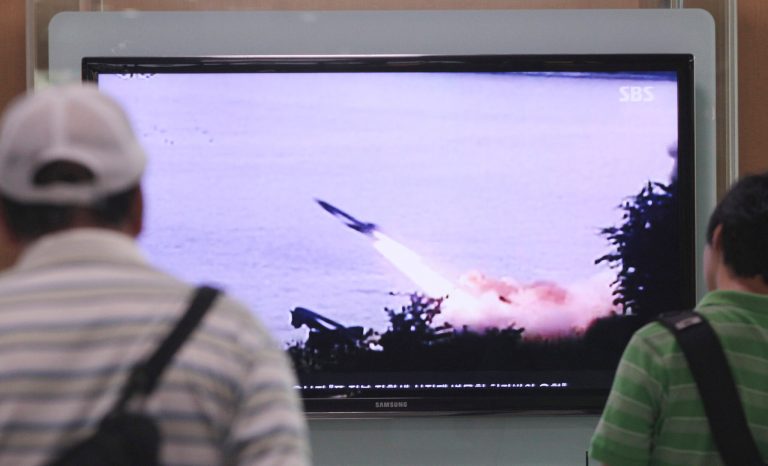 People watch a TV news program showing the missile launch conducted by North Korea, at Seoul Railway Station in Seoul, South Korea, Sunday, June 29, 2014. North Korea fired two short-range missiles into its eastern waters Sunday, a South Korean official said, an apparent test fire that comes just days after the country tested what it called new precision-guided missiles. (AP Photo/Ahn Young-joon)