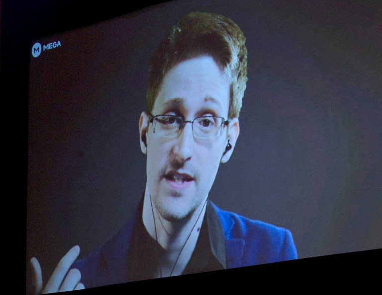 Former National Security Agency systems analyst turned leaker Edward Snowden appears via video link from Russia to hundreds of people in Auckland, New Zealand, Town Hall, Monday, Sept. 15, 2014. (AP Photo/New Zealand Herald, Brett Phibbs)