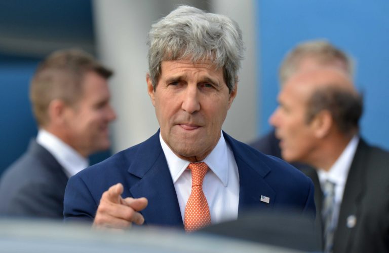 FILE - In this Monday, Aug. 11, 2014 file photo, U.S. Secretary of State John Kerry points a finger as he arrives in Sydney. In its latest personal attack on a prominent official, North Korea has called Kerry a wild dog with a 