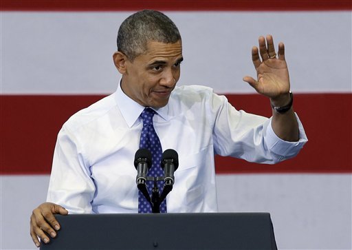 In Massachusetts, Obama praises Romneycare as a model for the country