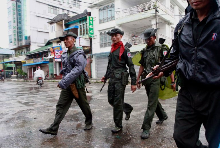   Myanmar soldiers patrol on a street in Sittwe, the capital of Rakhine state in western Myanmar, Friday, June 15, 2012. The communal violence that swept through the western Myanmar state over the past week killed dozens of people. (AP Photo/Khin Maung Win)  