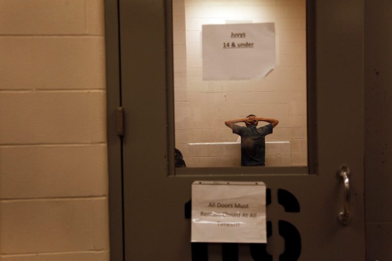 An Immigrant who was detained at the border is held inside the McAllen Border Patrol Station in McAllen, Texas , Tuesday July 15, 2014, in an area for juveniles 14 and under. A solution for the growing crisis of tens of thousands of unaccompanied children showing up at the U.S.-Mexico border is looking increasingly elusive with three weeks left before Congress leaves Washington for an annual August recess. (AP Photo/Los Angeles Times, Rick Loomis, Pool)