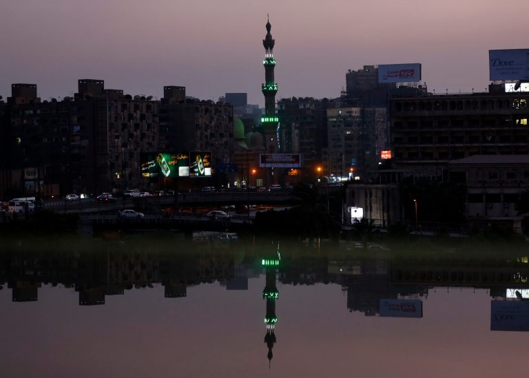   A mosque's minaret near the river Nile river is reflected on an open office window in Cairo, Egypt, Sunday, Aug. 25, 2013. (AP Photo/Lefteris Pitarakis)  