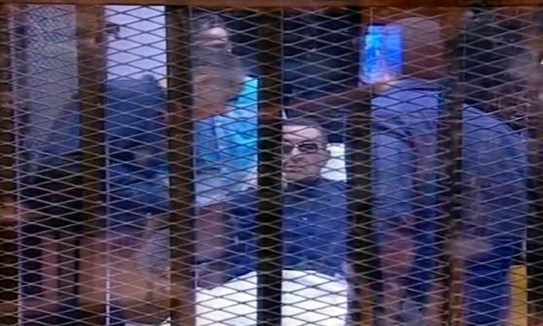 In this video image taken from Egyptian State Television, 86-year-old former Egyptian president Hosni Mubarak is seen in the defendant's cage during a retrial court hearing on charges of complicity in the killing of protesters during the 2011 uprising that forced him from power, in Cairo, Egypt, Saturday, Sept. 27, 2014. The Egyptian court has postponed its verdict until November in the retrial of Mubarak. He was the first Arab ruler to be brought to court by his own people. (AP Photo/Egyptian State TV)   EGYPT OUT
