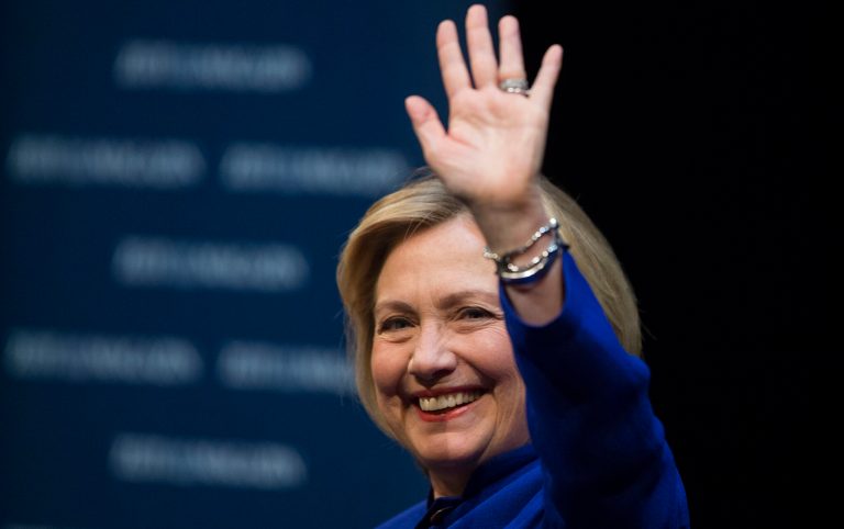 Former U.S. Secretary of State Hillary Clinton waves to the audience during a book launch in Berlin, Germany, Sunday. (AP Photo/Gero Breloer)