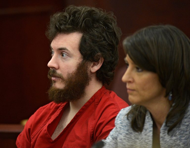 FILE - In this March 12, 2013 file photo, James Holmes, left, and defense attorney Tamara Brady appear in district court in Centennial, Colo. for his arraignment. Lawyers for Holmes, the man accused of killing 12 people and injuring 70 in a Colorado movie theater, said Tuesday May 7, 2013 he wants to change his plea to not guilty by reason of insanity. (AP Photo/The Denver Post, RJ Sangosti, Pool, File)
