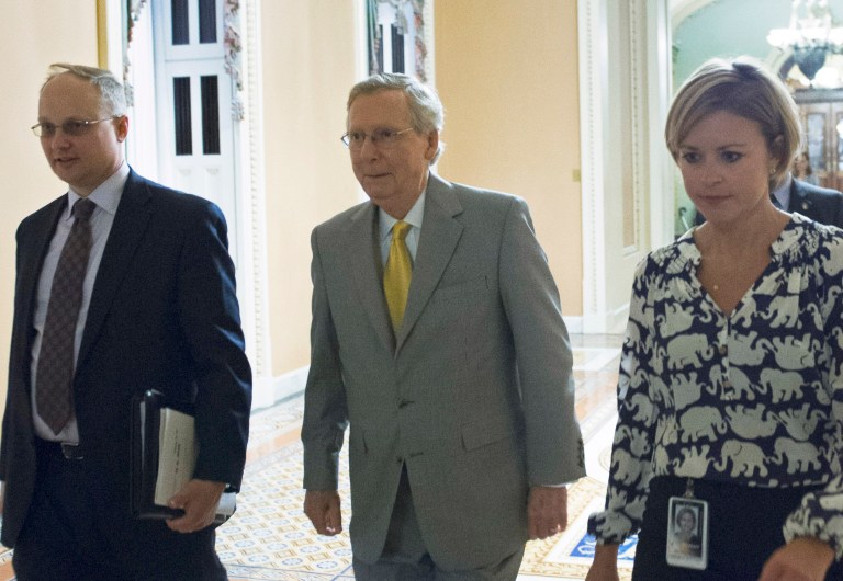 Senate Majority Leader Mitch McConnell, R-Ky., leaves the Senate Chamber after offering amendments to the USA Freedom act during a special session to extend surveillance programs, in Washington, Sunday, May 31, 2015. (AP Photo/Cliff Owen)