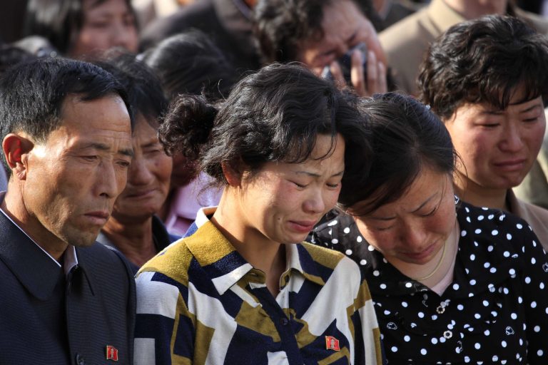 In this Saturday, May 17, 2014 photo, families of victims of an accident at an apartment construction site in Pyongyang, North Korea grieve during a gathering in the capital where senior officials apologized and took responsibility. The word of the collapse in the secretive nation's capital was reported Sunday morning by the North's official Korean Central News Agency, which gave no death toll but said that the accident was 