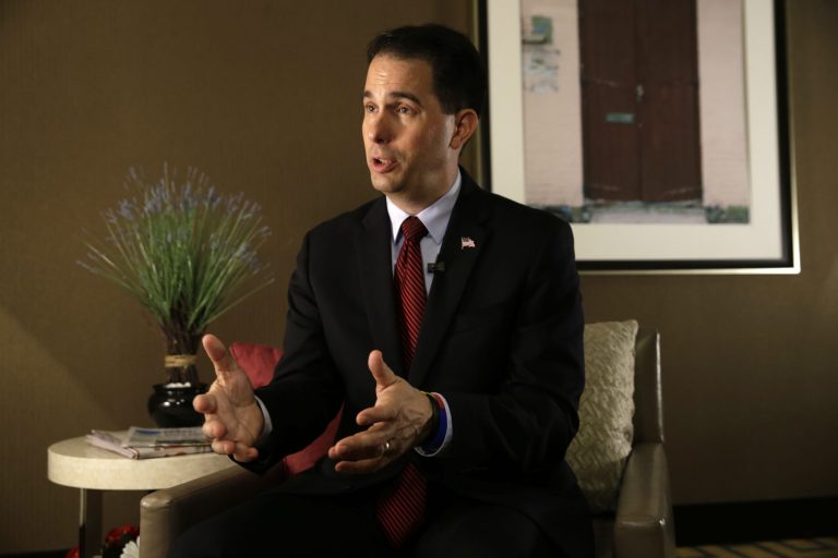 Scott Walker said his state's utility regulators estimate that complying with the rule would cost up to $13.4 billion and drive up electricity rates as much as 29 percent. (AP Photo)Â 