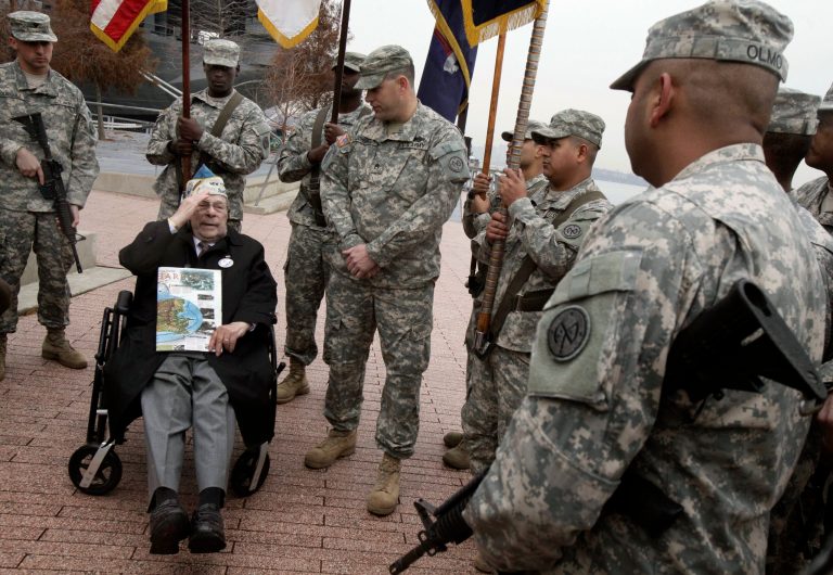   Pearl Harbor survivor Daniel Fruchter, of Eastchester, N.Y., salutes members of a color guard from his wheelchair during a visit at the Intrepid Sea, Air and Space Museum in New York, before ceremonies commemorating the 71st anniversary of the attack at Pearl Harbor, Friday, Dec. 7, 2012. President Barack Obama marked the day on Thursday by issuing a presidential proclamation, calling for flags to fly at half-staff on Friday and asking all Americans to observe the day of remembrance and honor military service members and veterans. (AP Photo/Richard Drew)  